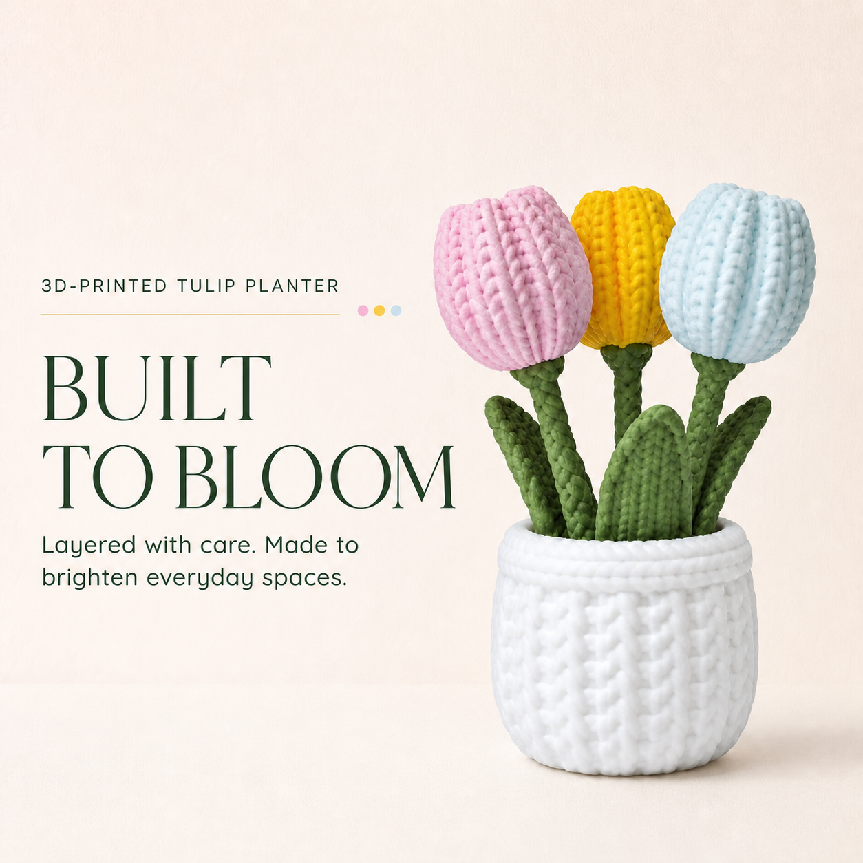 A 3D-printed tulip planter featuring three knitted tulips in pink, yellow, and light blue, planted in a white textured pot. The image includes promotional text on the left reading '3D-PRINTED TULIP PLANTER', 'BUILT TO BLOOM', and 'Layered with care.