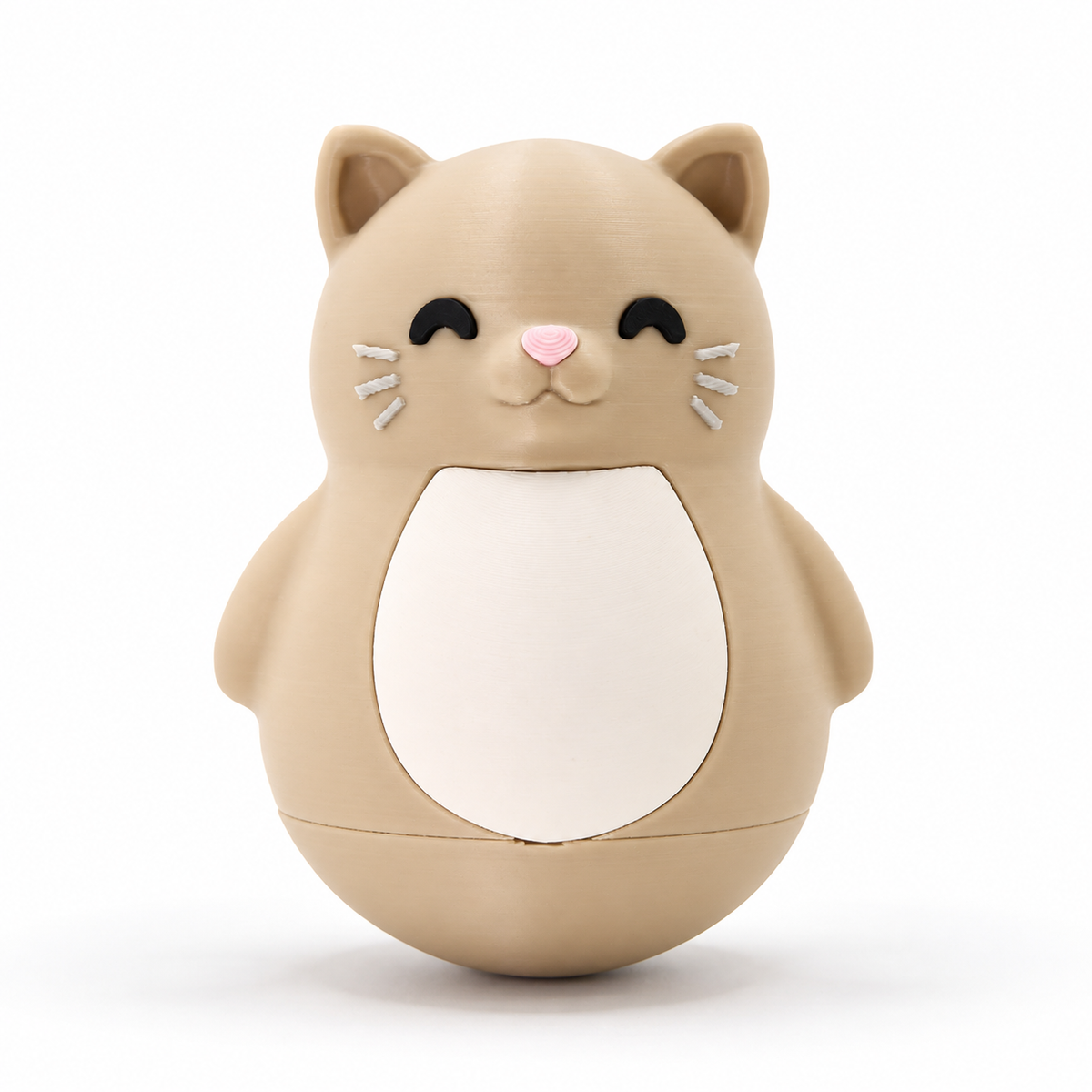 A cute, rounded cat-shaped container or toy in a warm beige/tan color, featuring a white belly panel, black closed eyes, a small pink nose, and white whiskers, set against a clean white background.