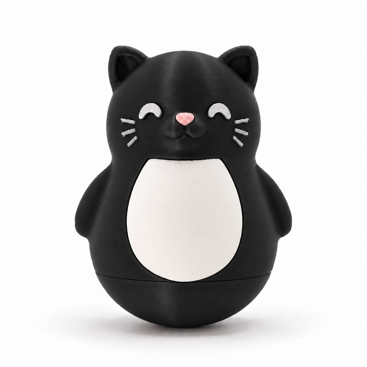 A black cat-shaped container or toy with a white belly, pink nose, and white whiskers, photographed on a clean white background.