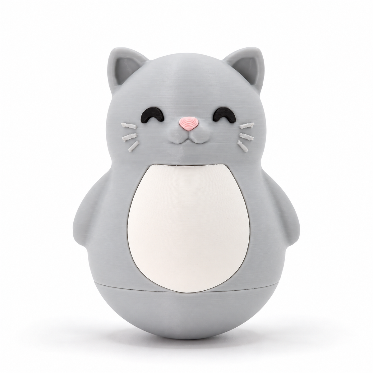 A gray cat-shaped container or toy with a white belly panel, black eyes, a pink nose, and white whiskers, photographed on a clean white background.
