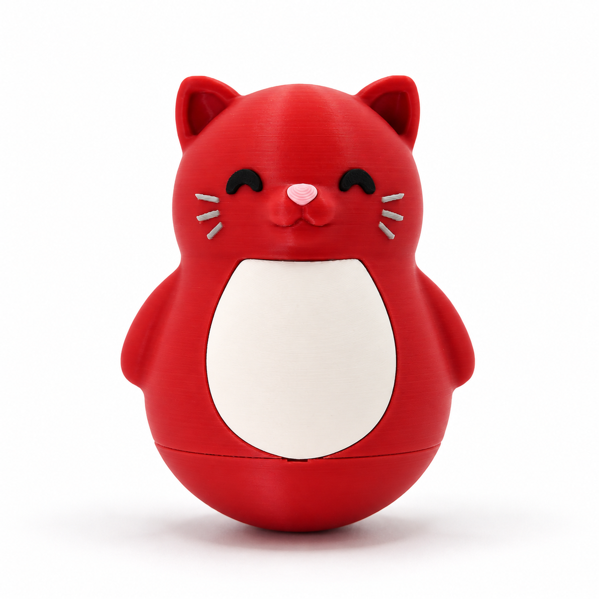 A red cat-shaped container or toy with a white belly panel, black closed eyes, a small pink nose, and gray whiskers, centered on a white background.