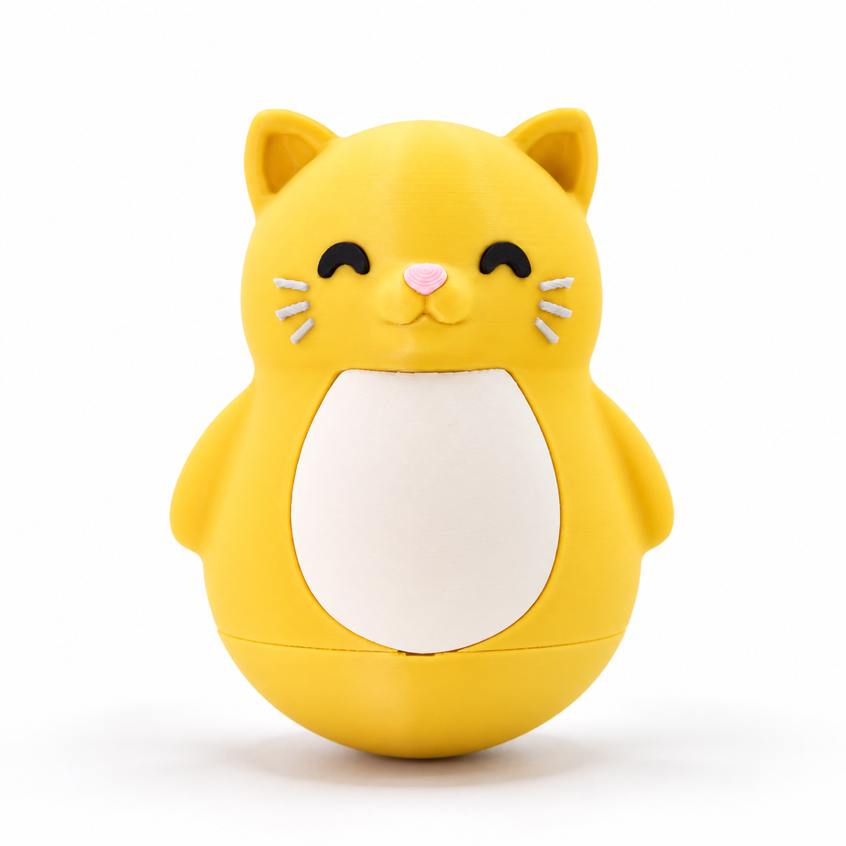 A yellow cat-shaped container or toy with a white belly panel, black closed eyes, a pink nose, and small white whiskers, photographed on a clean white background.
