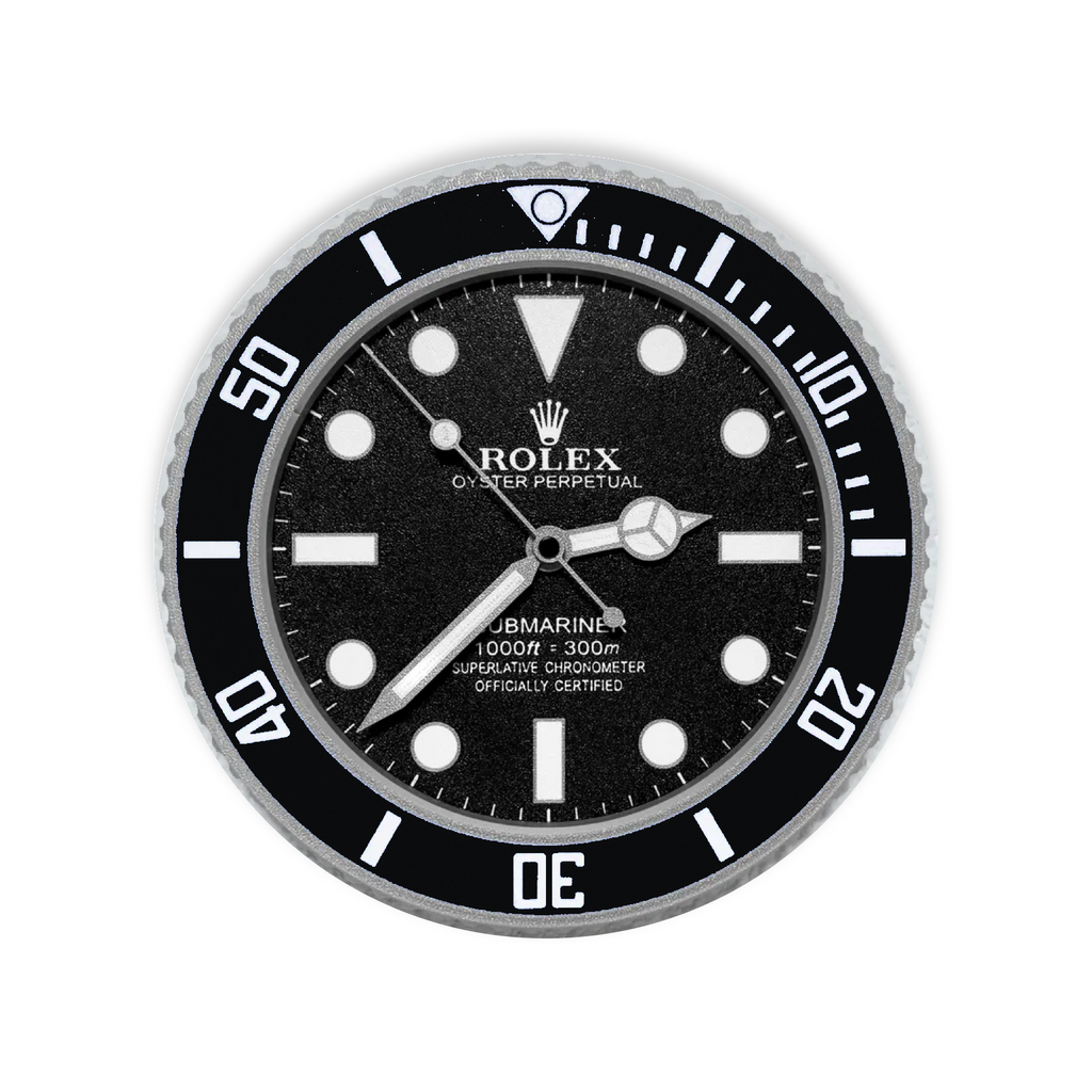 A circular wall clock styled as a Rolex Submariner, featuring a black dial and bezel, silver-tone hands and markers, and a textured silver outer bezel, shown against a plain white background.