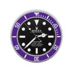 A circular wall clock styled like a Rolex Submariner, featuring a black dial, white markers and hands, and a prominent purple rotating bezel with white markings.