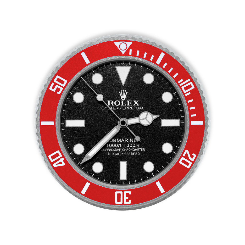 A Rolex Submariner wall clock featuring a bold red rotating bezel, black dial, silver-tone hands and markers, and a textured silver-tone bezel.