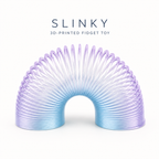 A 3D-printed Slinky fidget toy with a translucent plastic texture, featuring a smooth color gradient from light blue at the bottom to light purple at the top, displayed on a clean white background with text above reading 'SLINKY 3D-PRINTED FIDGET TOY'.