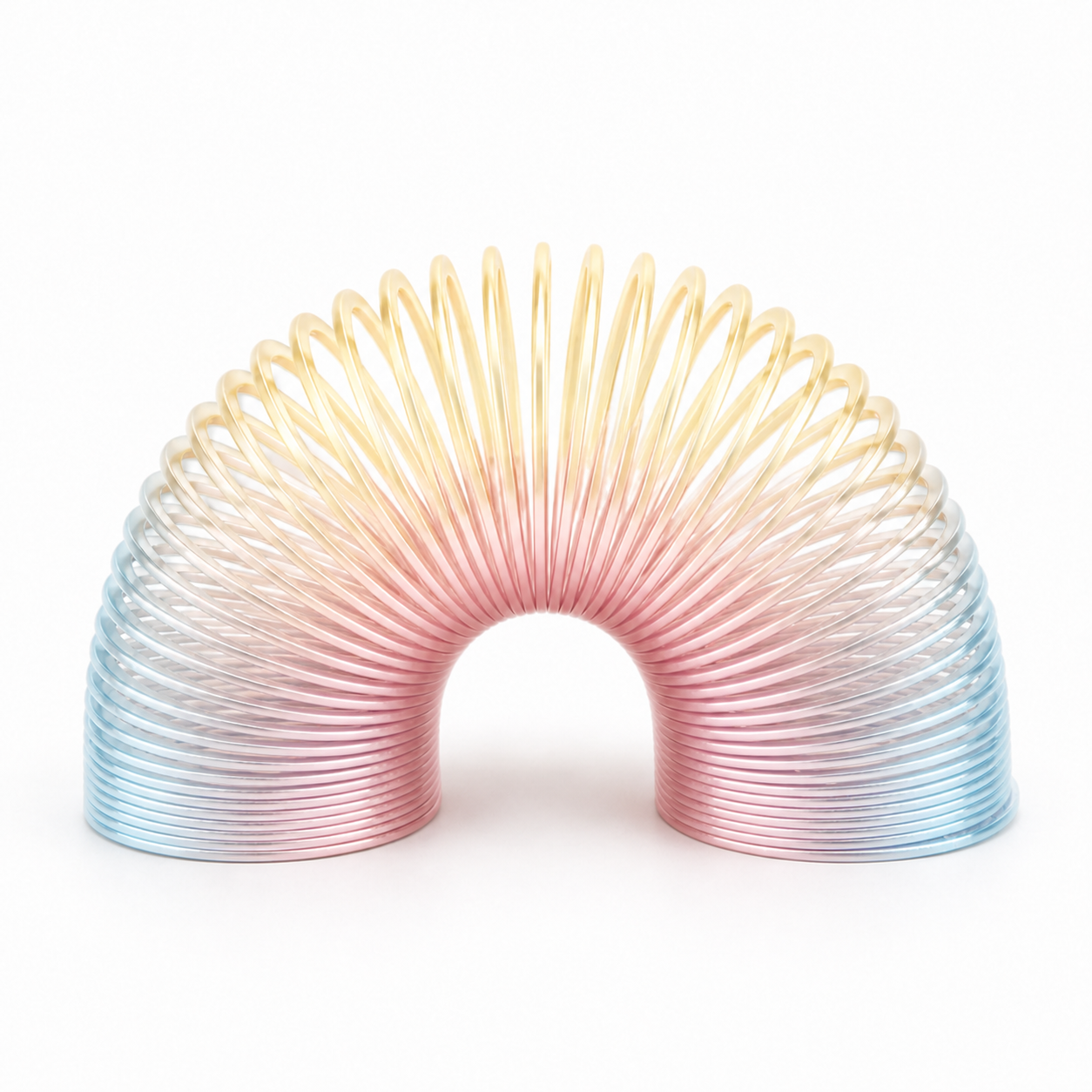 A translucent rainbow-colored elastic slinky toy on a clean white background.