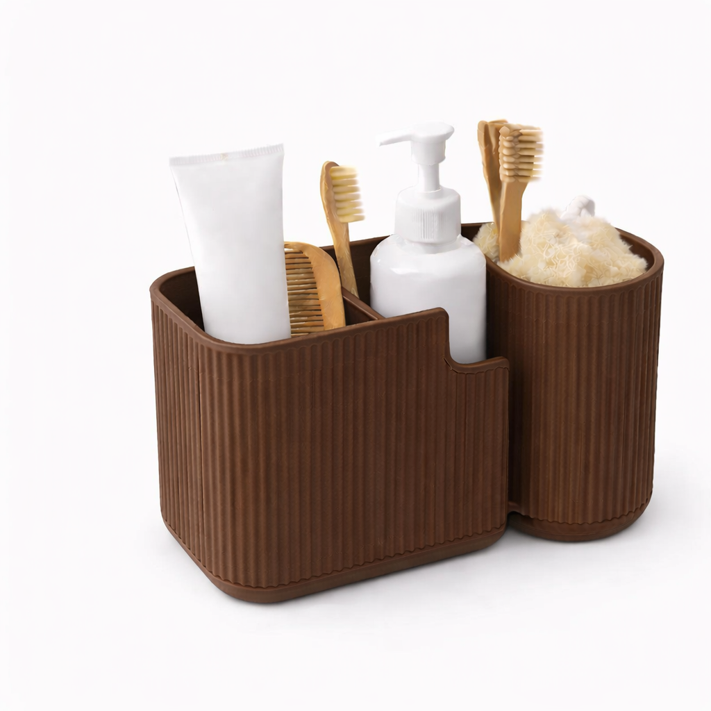 Brown bathroom caddy with toiletries including a tube of cream, bottles, and brushes on a white background