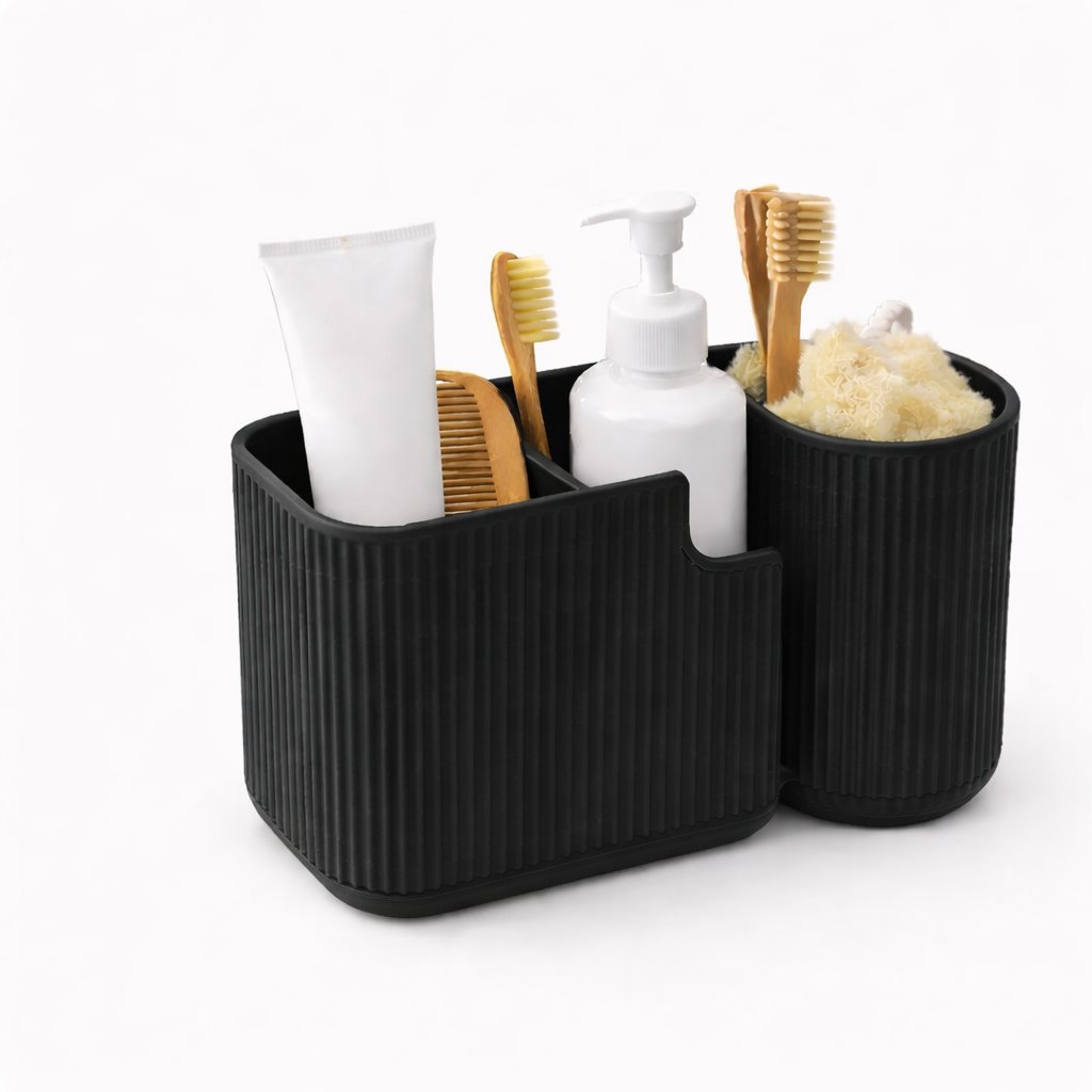 Black bathroom caddy with toiletries including toothbrushes and bottles on a white background