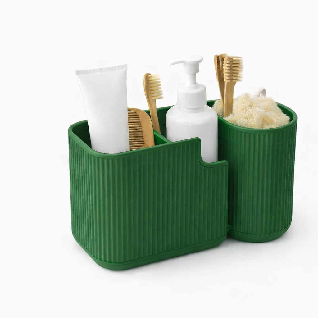 Green bathroom caddy with toiletries including toothbrushes and bottles on a white background