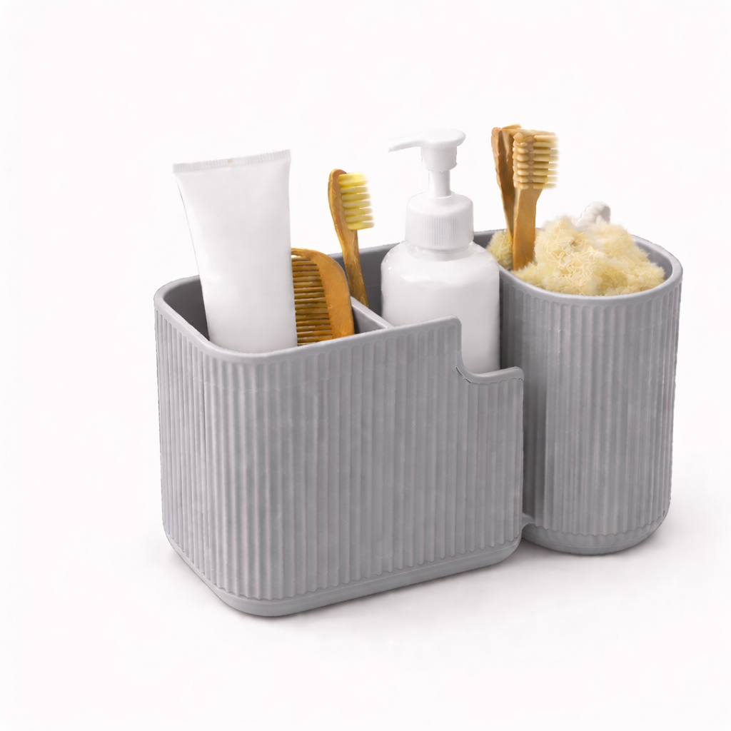 Gray bathroom caddy with toiletries including toothbrushes and bottles on a white background