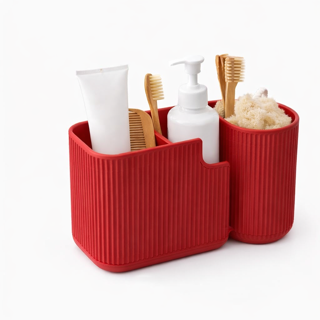 Red bathroom caddy with toiletries including a tube of cream, bottles, and toothbrushes on a white background.